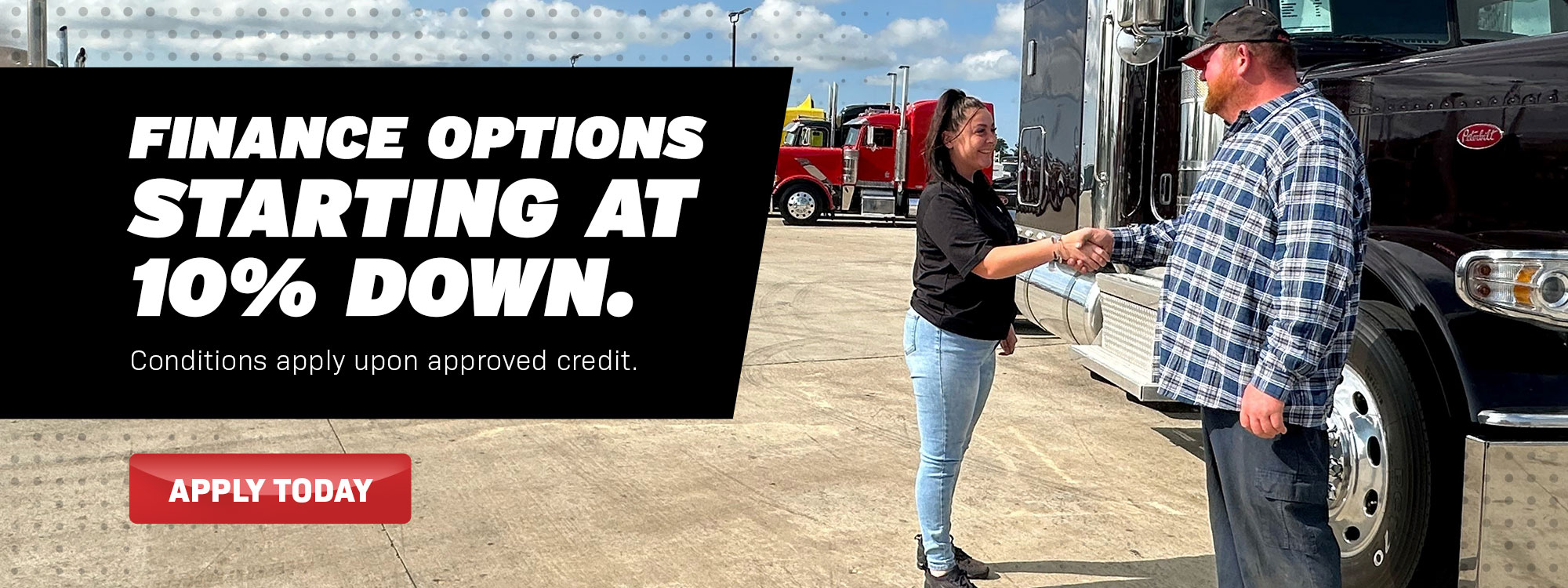 Woman and man shaking hands in front of a truck