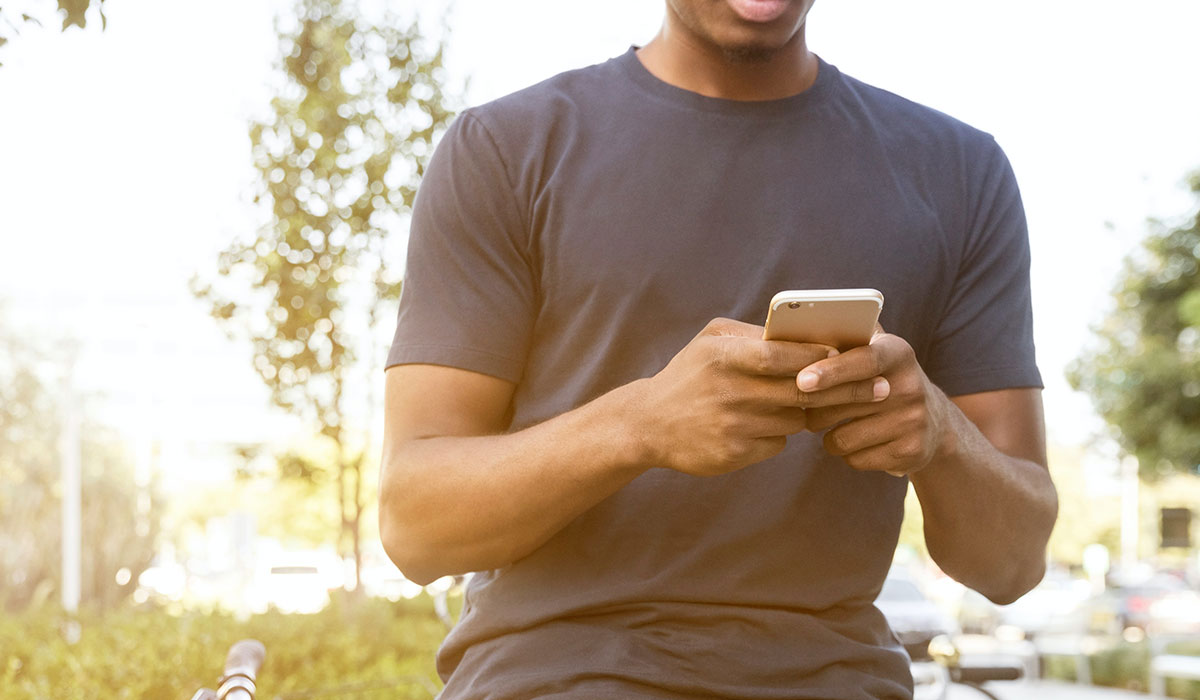 Man browsing an app on his phone