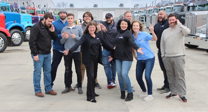 Finance tea mposing in the semi truck lot