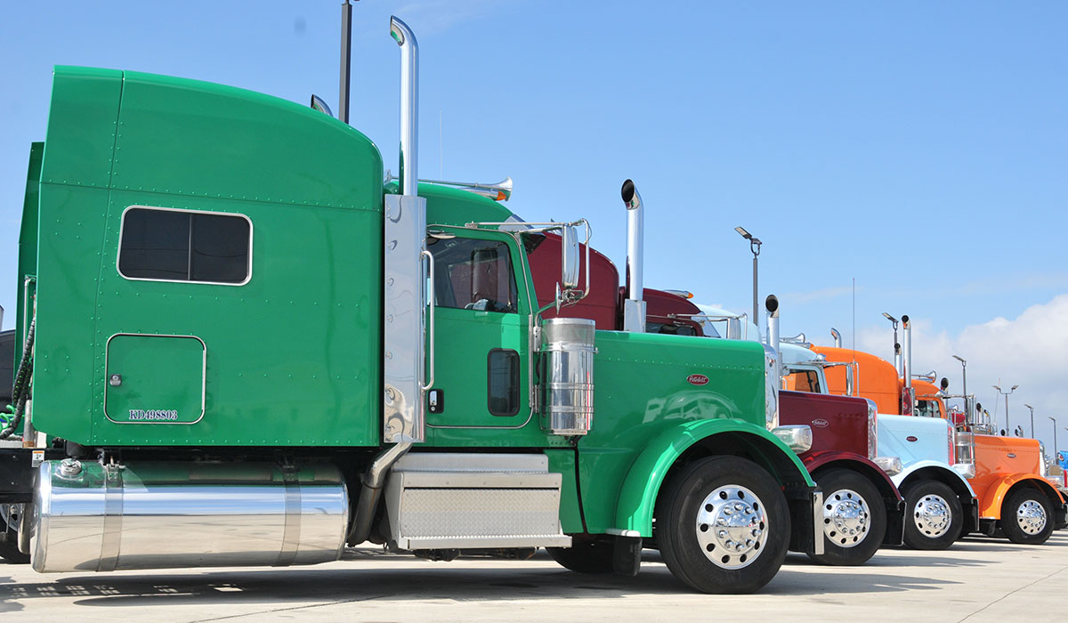 A row of Peterbilt semi trucks ready to be sold